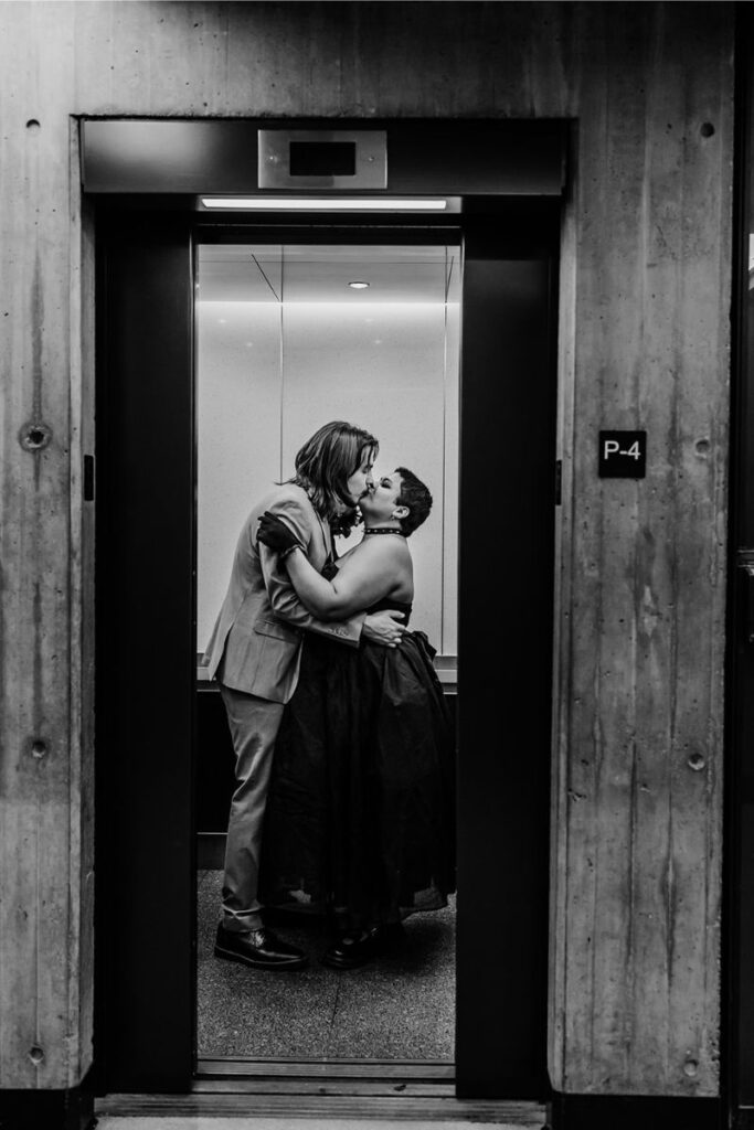 Tara and Clint kissing in elevator