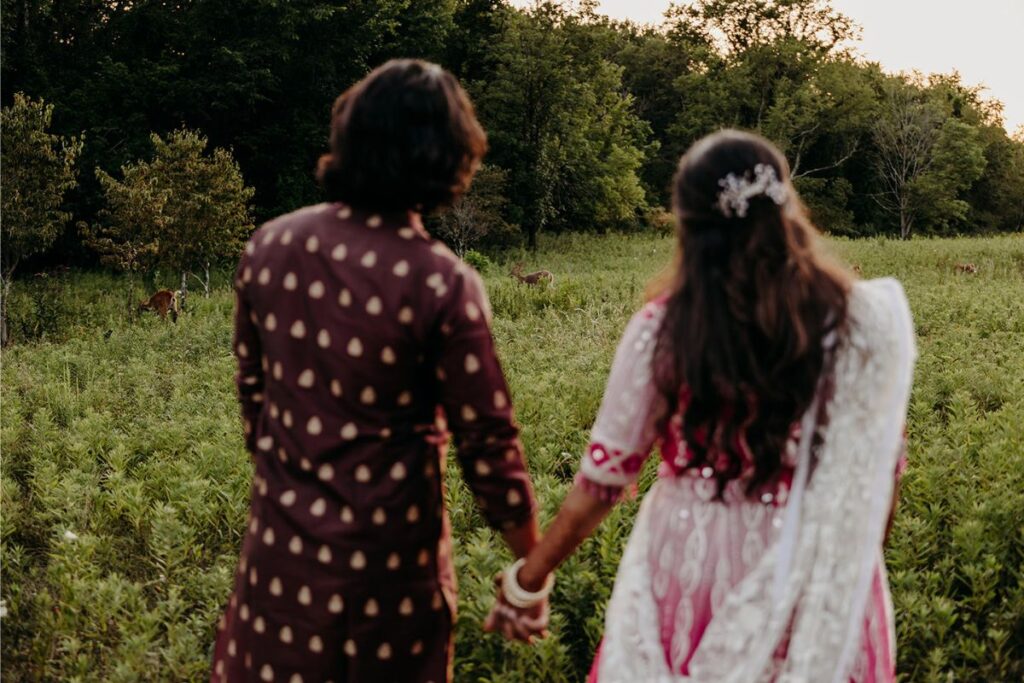 a couple walking in the green hills during their  destination weddings in Thailand
