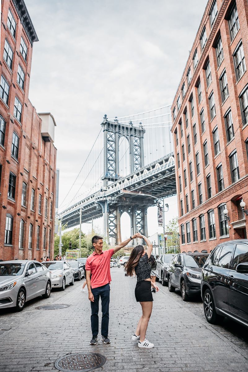 man spinng a woman on washington street in new york 