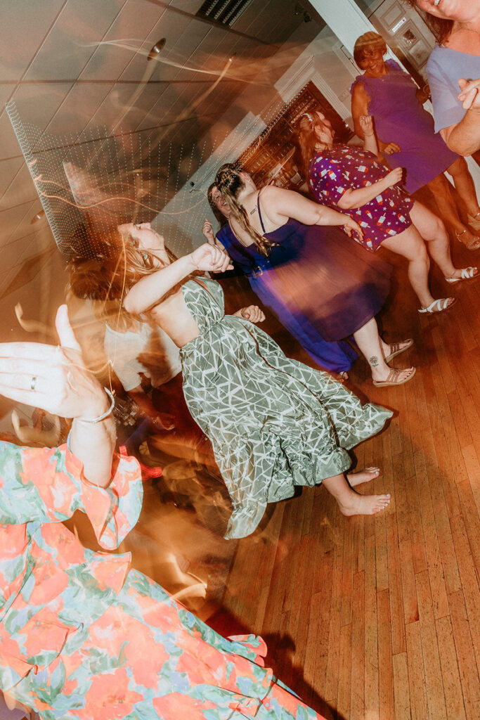 Wedding guests dancing at a reception 