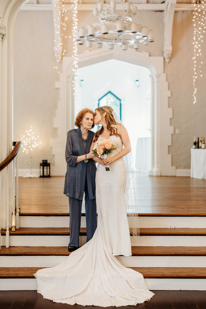 A bride kissing an elderly relative on the cheek 